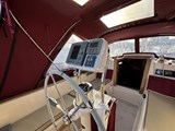 Island Packet 32- cockpit helm looking forward with camper cover on